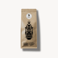 Café Granados Costa Rica Kaffee „Silver San Vito“ – freigestelltes Produktfoto eines Kraftpapier-Kaffeebeutels mit schwarzer Masken-Illustration und Rundlabel; 100 % Arabica, sonnengetrocknet.